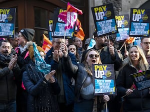 Sixth form college teachers holding banners during a demonstration