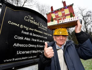 Tony Jefferies and the Crooked House hat he has helped create in support of re-building the demolished pub. 
He has recently added an outside area and working lights after hours of painstaking work