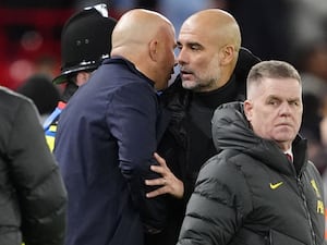 Arne Slot speaks to Pep Guardiola at full-time