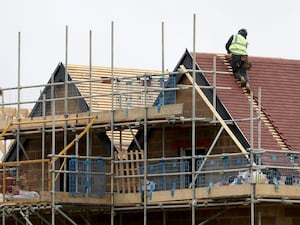 A roofer on a newbuild house