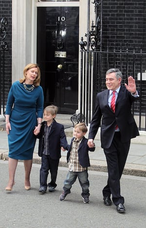 Gordon Brown leaves Downing Street for the last time with wife Sarah and sons John and Fraser.