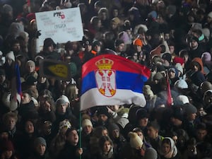 People protest in front of the state-run TV headquarters