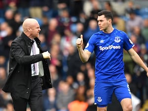 Everton's Michael Keane, right, with Sean Dyche