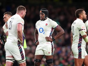 England's players look dejected after losing to Ireland