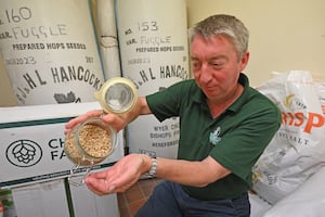 Jonothan Holden shows off the barley used to make the beer