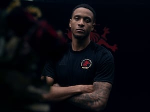 Aston Villa's Ezri Konsa models the kit.