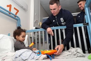 West Bromwich Albion F.C. captain Jed Wallace with a young patient at the Midland Met