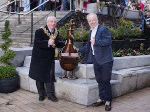 Wallace and Gromit creator Nick Park and the Mayor of Preston, Councillor Philip Crowe, pose next to the statue of the animated character Feathers McGraw at Animate in Preston