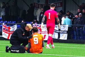 Stafford Rangers striker Dan Cockerline receiving treatment after dislocating his shoulder. Picture: Wendy Hill.