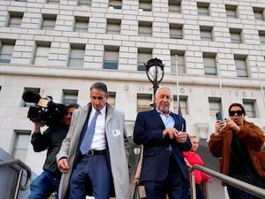 Lawyers Mark Geragos, centre, and Bryan Freedman, left, in Los Angeles