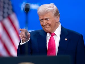 President Donald Trump gestures as he arrives to speak at the Conservative Political Action Conference,