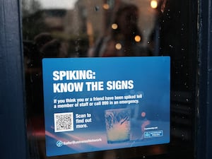 A drink spiking notice on the window of a pub in Greenwich, London