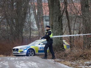 Police man puts out police tape