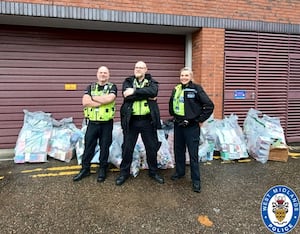 Officers from West Midlands Police show some of the items taken during the operation