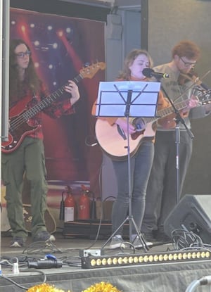 Local band entertaining shoppers