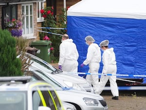 Forensic officers at the scene in Ashlyn Close, Bushey, Hertfordshire