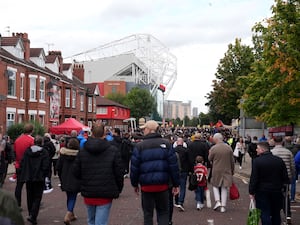 Manchester United fans walking towards Old Trafford