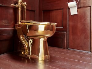 The gold toilet artwork