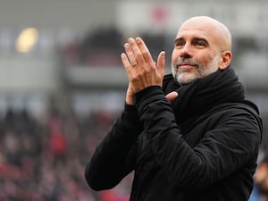 Pep Guardiola claps the fans