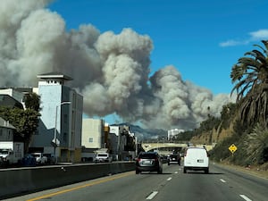 Heavy smoke from a brush fire in California seen from a motorway