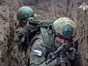 Russian soldiers with weapons in a trench