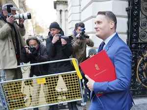 Wes Streeting arrives in Downing Street for a Cabinet meeting, carrying a red ministerial folder under his arm