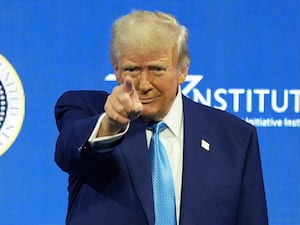 President Donald Trump arrives to speak at the Future Investment Initiative Institute summit in Miami Beach