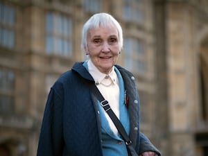 Anne Puckridge outside the Houses of Parliament in London