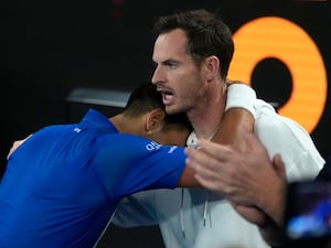 Novak Djokovic (left) hugs Andy Murray after his win over Carlos Alcaraz