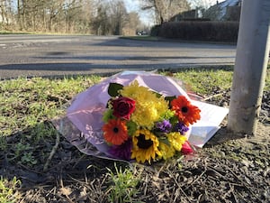 Flowers left near the scene of a crash in Pitsea, Essex, in which two children died