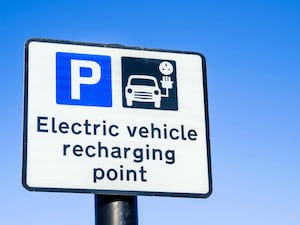 An electric vehicle charger sign