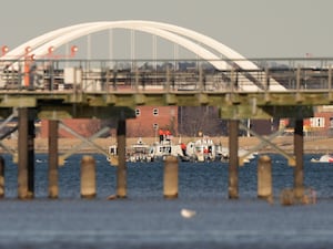 Police and rescue boats work in the Potomac River