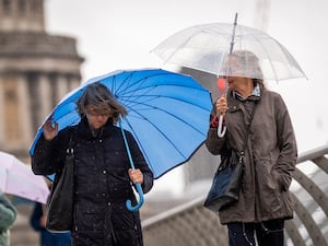 People carrying umbrellas