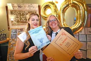 Duty manager Charlotte Gibson and pub manager Sian Siddall show off some of the items donated for the event