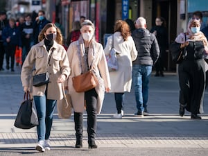 Shoppers wearing face masks on Oxford Street, in central London, in 2021