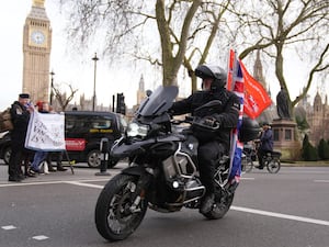 A military veteran riding an motorbike