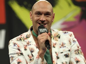 Tyson Fury poses with his WBC heavyweight title