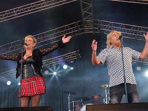 Cheryl Baker and Mike Nolan performing on stage