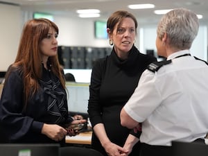 Safeguarding minister Jess Phillips (centre) and campaigner Nour Norris (left) during their visit to the West Midlands Police control room in Birmingham