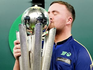 Littler kisses the trophy