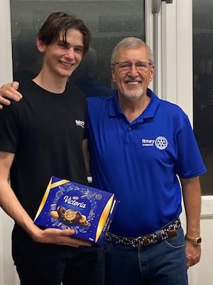 Beetle Drive winner Freddie Sutton with  Rotarian Allan Rotchell