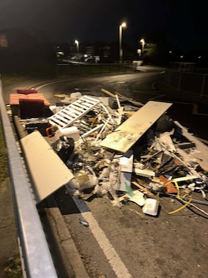 The waste was found outside Milking Bank Primary school and was cleared by Councillor Asif Ahmed and residents