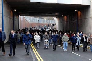 A group of pedestrians trying out the Tipton tunnel during its opening in 2010