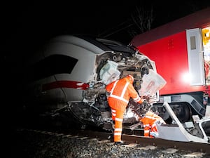 Engineers work at the scene of a train accident,