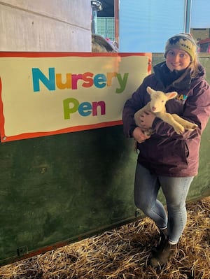 Lliwen Daffyd who is on a work placement at Lower Drayton Farm while studying at Harper Adams University, with one of the new arrivals.