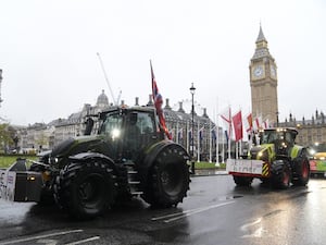 Two tractors with Parliament in the background