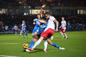 Charlie Lakin challenges for the ball. (Image by Owen Russell)