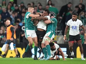 Fiji’s Elia Canakaivata is tackled by Ireland’s Sam Prendergast