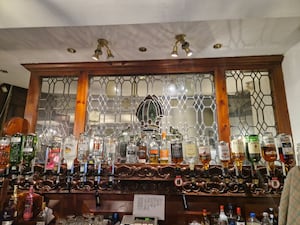 The Mitre Hat which is included in the glass work behind the bar at the Lower High Street pub