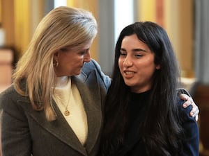 The Duchess of Edinburgh speaking to Yazidi survivor Awaz Abdi during her visit to view The Women Who Beat ISIS travelling photo exhibition